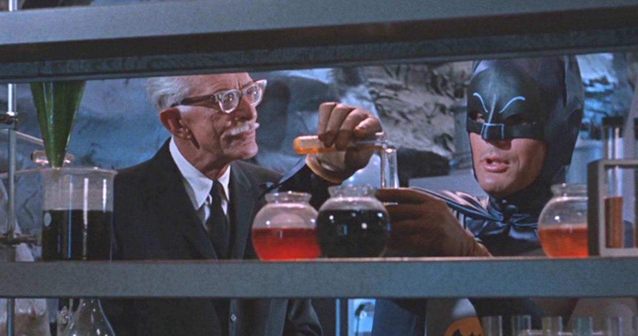 Batman and Alfred playing with beakers